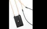 The Casery Crossbody Phone Pocket is designed to accommodate most smartphones. The phone pocket comes with a clip-on rose gold chain that turns it into a small crossbody purse. The product has room for four credit cards and has a snap closure for security.
