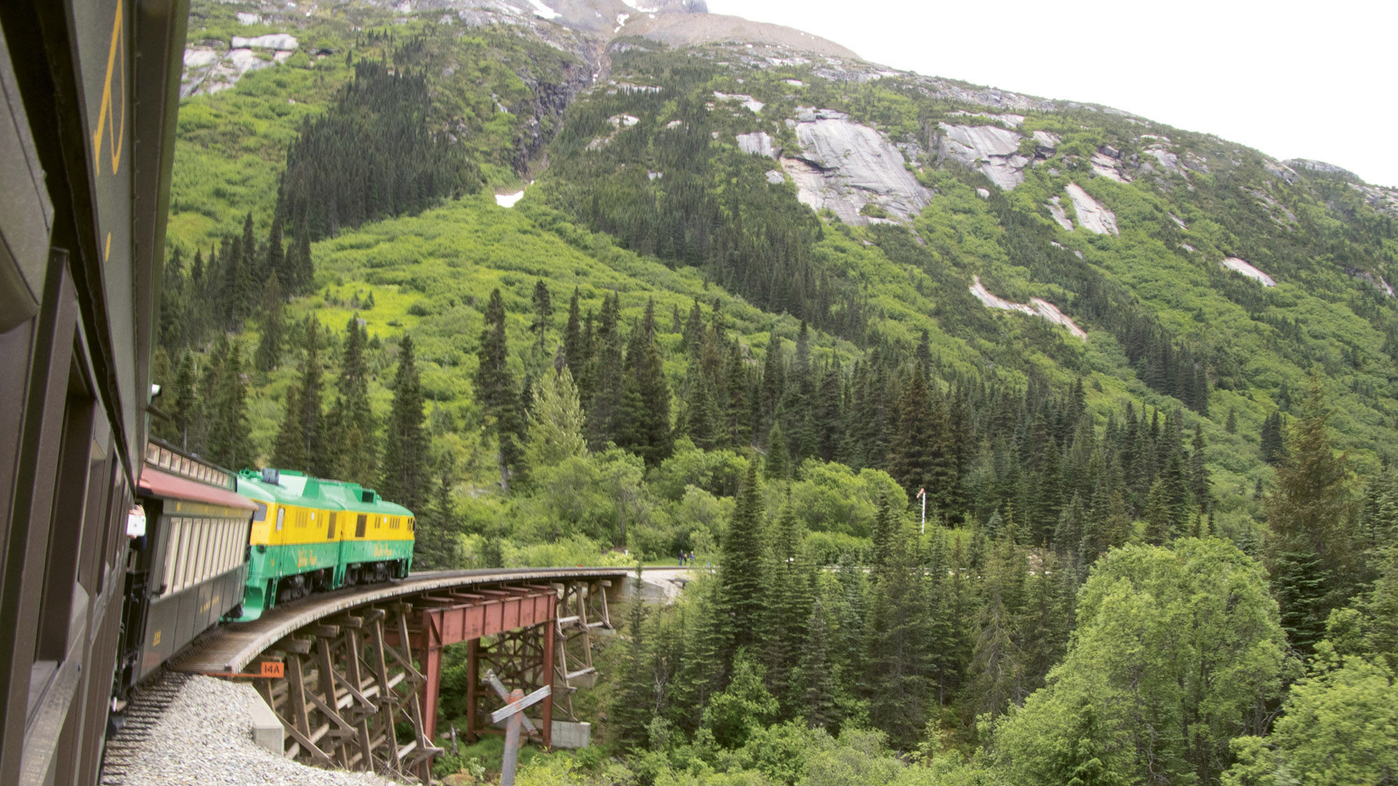 A tourist train along the White Pass & Yukon Route Railroad makes its way back to Skagway.