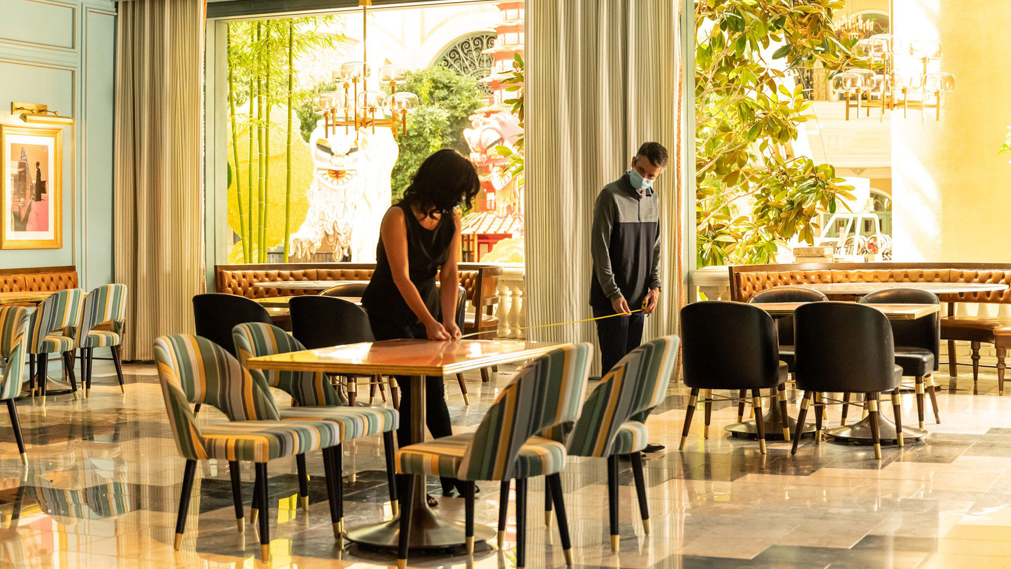MGM Resorts' employees reconfigure dining spaces at Sadelle's Cafe in Bellagio to allow for physical distancing.