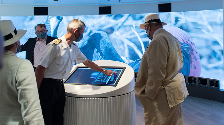 Dutch shipyard De Hoop delivered the Silver Origin, an expedition ship bound for the Galapagos, in a June 3 ceremony. An officer showed Silversea chairman Manfredi Lefebvre, far right, the interactive, LED wall in the Origin's Basecamp area.