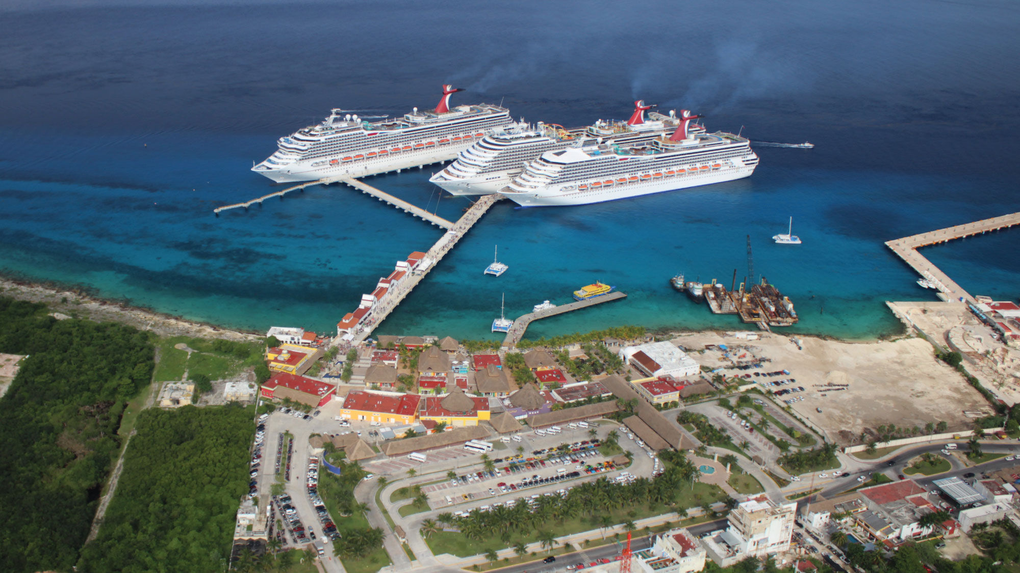 Carnival Cruise Line ships in Cozumel, Mexico. As it works towards a restart, the cruise industry must work with port authorities and governments to agree on health protocols.
