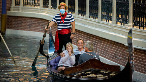 A gondolier wears a mask at the Grand Canal Shoppes on June 4. His passengers did not. A gondolier wears a mask at the Grand Canal Shoppes on June 4. His passengers did not.