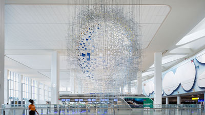 High ceilings and custom artwork punctuate the light, bright design of Terminal B's new arrivals and departures hall.