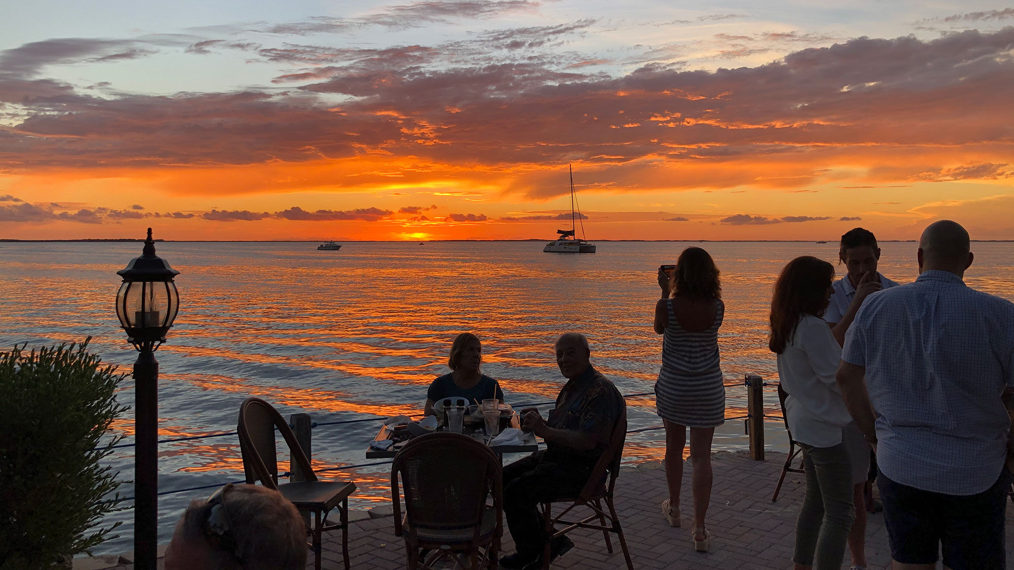At a Key Largo restaurant, patrons observed the sunset, if not textbook social distancing.