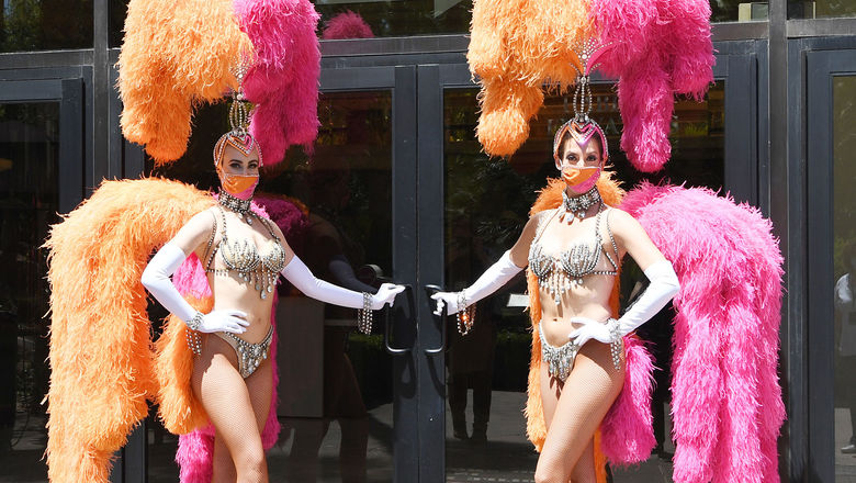 Flamingo Las Vegas showgirls wear masks when welcoming guests.