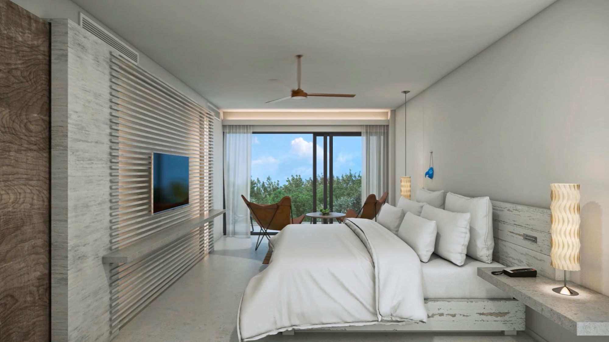 Bedroom of a junior suite at Andaz Mayakoba Resort Riviera Maya.