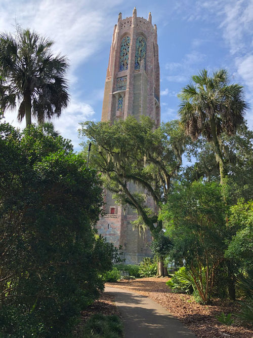 The winding path through the gardens designed by Frederick Law Olmstead Jr., gradually reveals the centerpiece tower The winding path through the gardens designed by Frederick Law Olmstead Jr., gradually reveals the centerpiece tower
