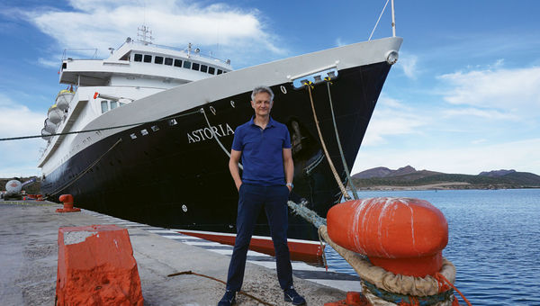 Cruise ship historian Peter Knego in front of Cruise and Maritime Voyages’ Astoria, which was built in 1948 as an ocean liner.