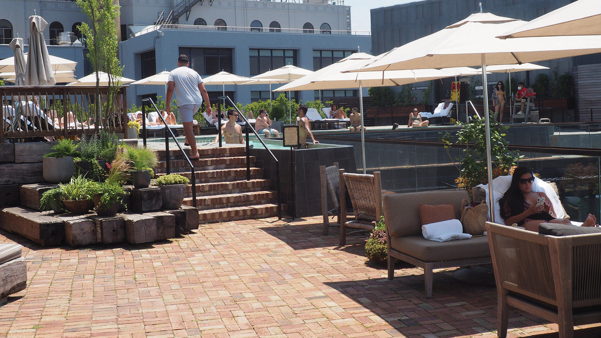 The rooftop pool at the 1 Hotel Brooklyn Bridge, where strict limits have been placed on capacity.