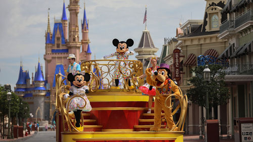 Guests will ssee Disney characters throughout the parks, like during the Mickey and Friends Cavalcade.