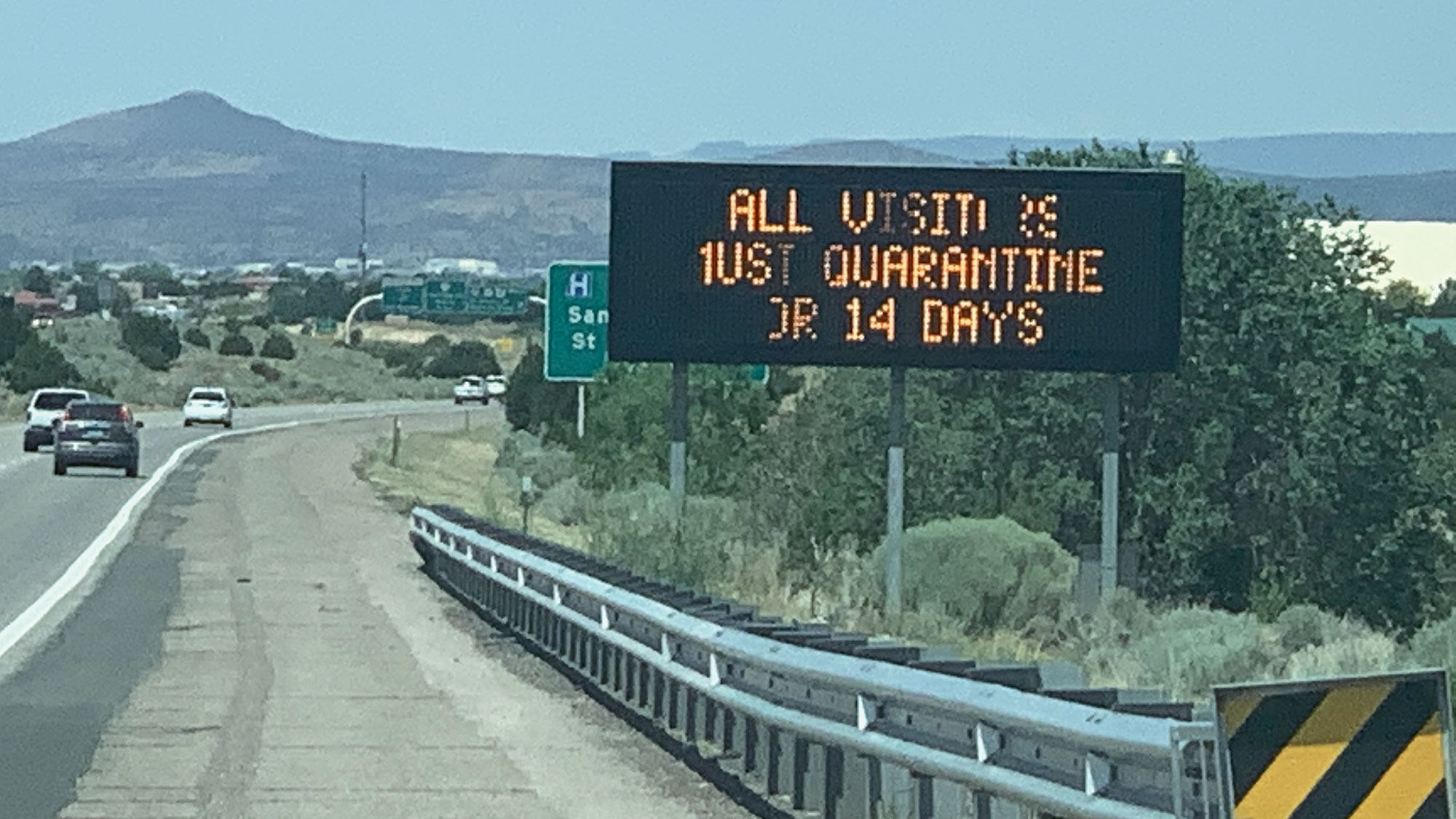 A sign along a highway in New Mexico informs visitors they must quarantine.