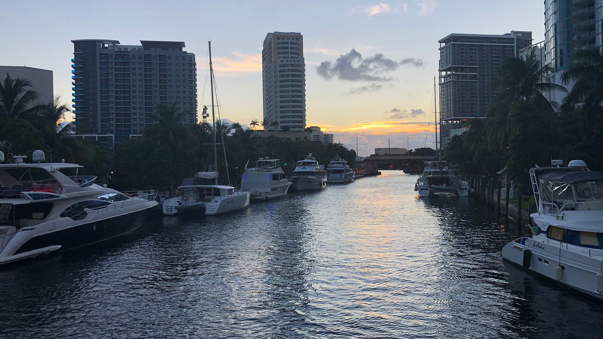 The New River in downtown Fort Lauderdale is lined with big boats on a Jungle Queen sunset cruise.