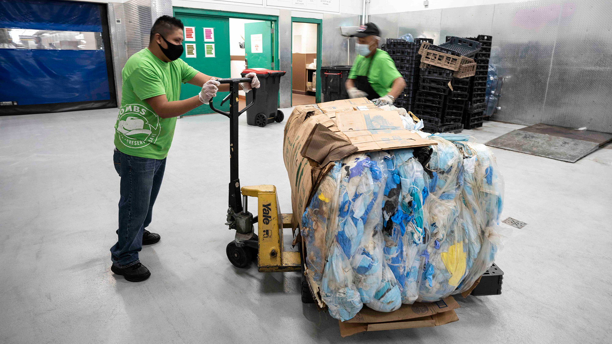 A bundle of 644 pounds of discarded surgical masks is packed up for recycling.