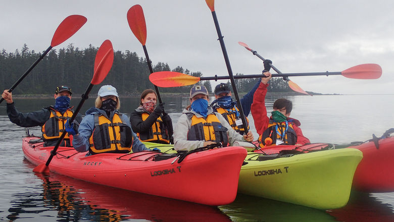 Passengers on the Wilderness Adventurer in kayaks during the line's first Alaska cruise in 2020, which was cut short after a passenger's Covid test came back positive.