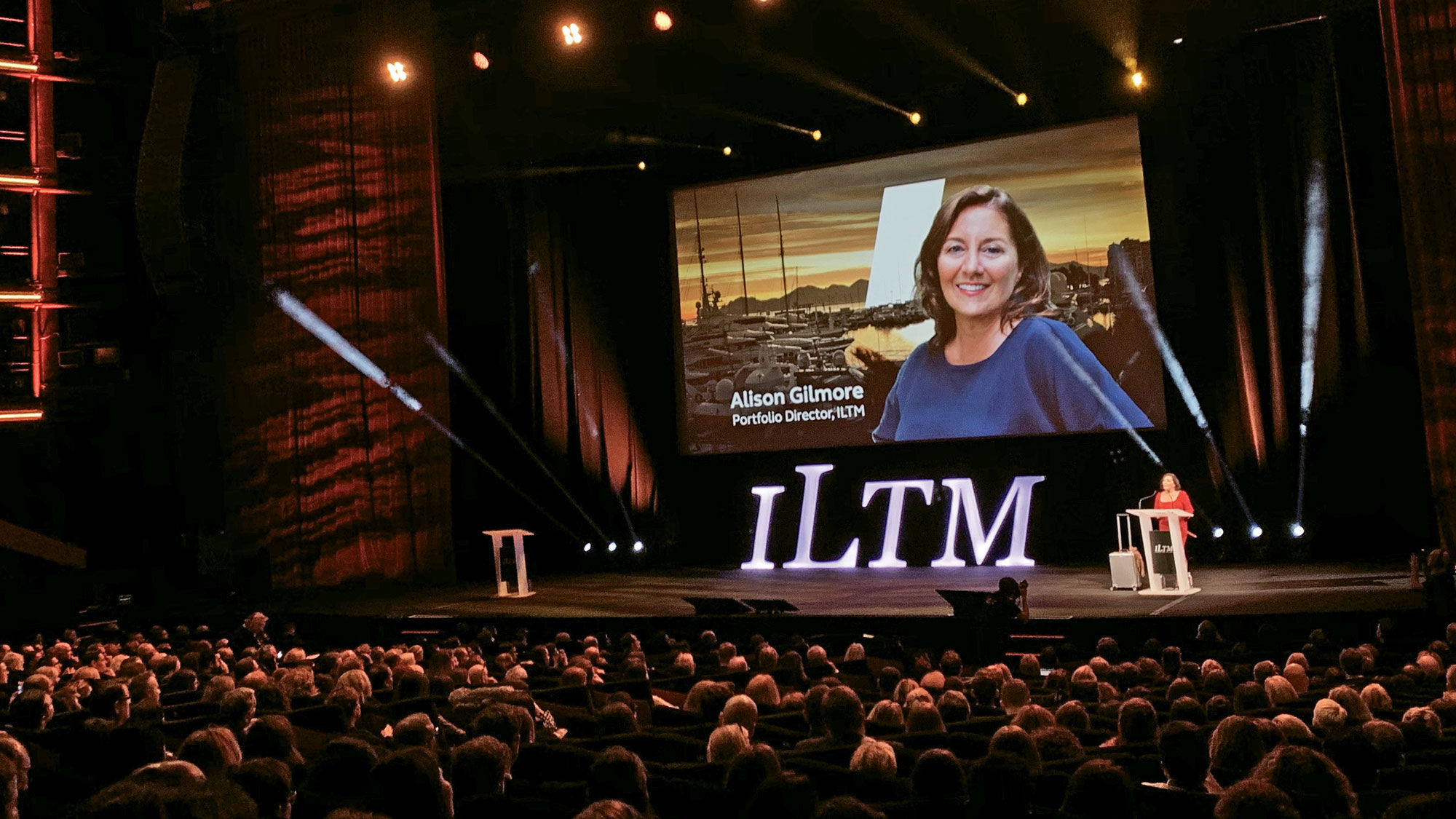 ILTM portfolio director Alison Gilmore on the big screen at last year's event in Cannes.