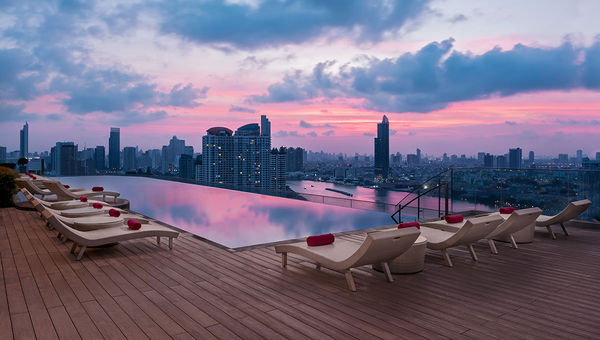 The rooftop deck at the Avani+ Riverside Bangkok at dawn. The rooftop deck at the Avani+ Riverside Bangkok at dawn.