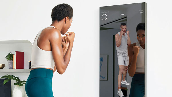 Working out with a Mirror interactive fitness system.