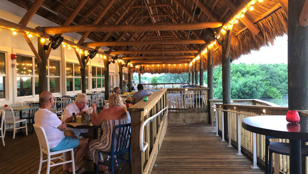 The Floridays Woodfire Grill and Bar features this thatch-roof, outdoor dining area with water views of Anna Maria Sound. The Floridays Woodfire Grill and Bar features this thatch-roof, outdoor dining area with water views of Anna Maria Sound.