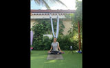 In addition to leading classes at the Hyatt Regency resort in Aruba, Maria Pucci offers private anti-gravity yoga classes in a garden at her home.