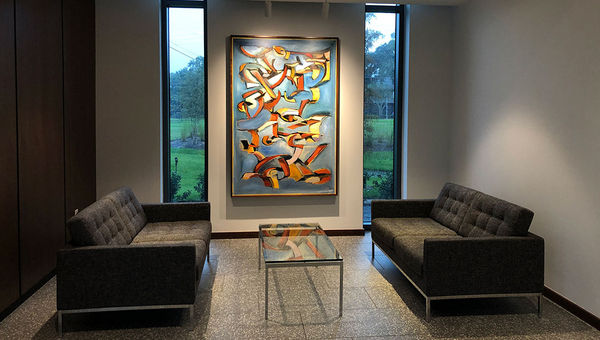 The lobby at Hotel ELEO is uncluttered and features modernist abstract art.