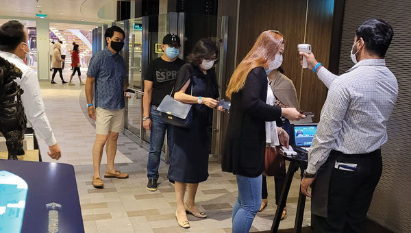 Breakfast queues are orderly, with safety and sanitation checks in place. Breakfast queues are orderly, with safety and sanitation checks in place.