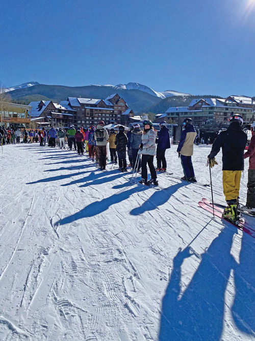 Long lift and gondola lines like this one forced Colorado's Winter Park to require pass holders to make reservations, reversing its initial no-reservation policy.