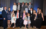 Stewart surrounded by family members at the Caribbean Hotel and Resort Investment Summit.
