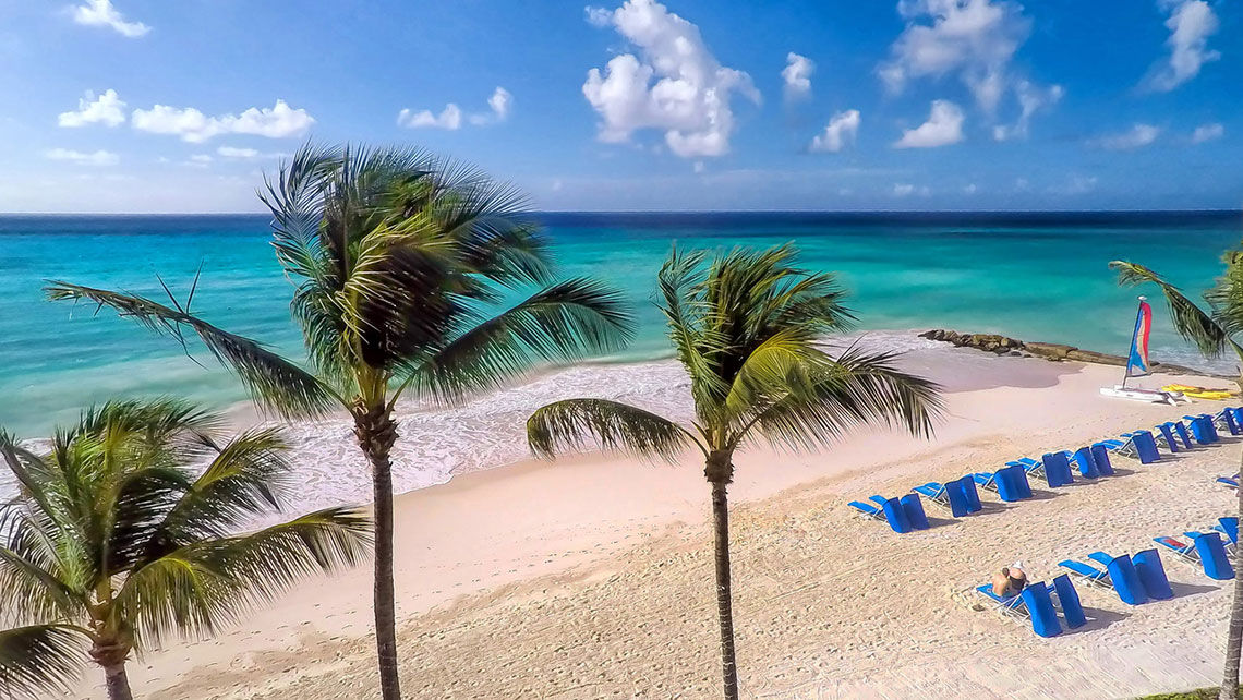 A nearly empty beach in Barbados. The country is tightening its rules for citizens and visitors after an increase in Covid-19 cases.