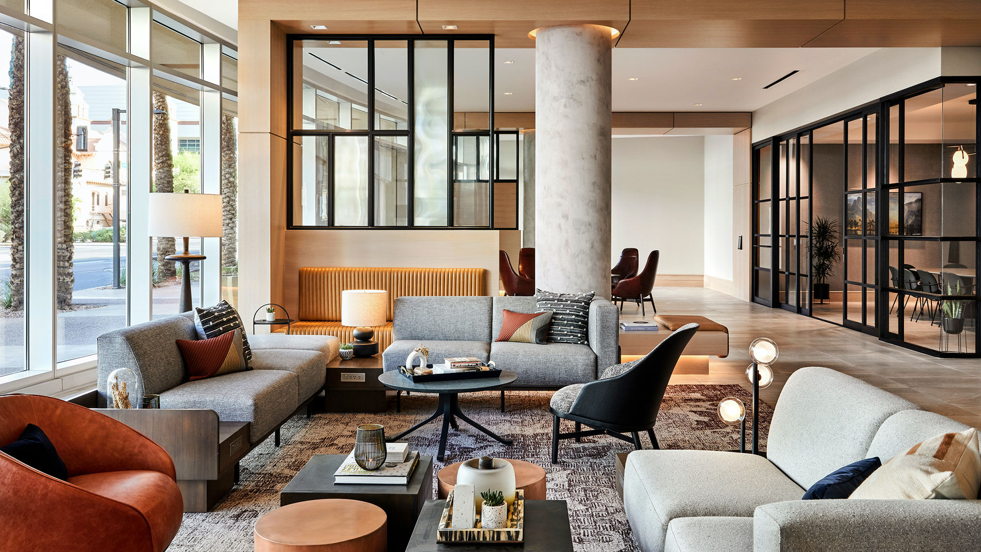 The new "Public Square" lobby at the Sheraton Phoenix Downtown features flexible, tech-enabled Studio areas, at right, which can be used for small meetings or private dining experiences.