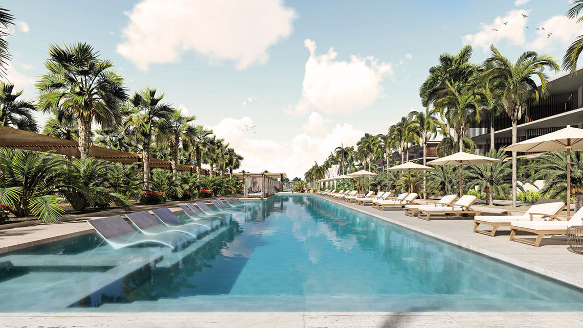 An expansive linear pool takes center stage at the new Live Aqua Beach Resort Punta Cana.