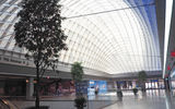 Moynihan Train Hall's Midblock Hall, which offers quick access to 31st and 33rd Streets and taxi and ride-share connections. The Hall will also be home to a food court, which is set to open this fall.
