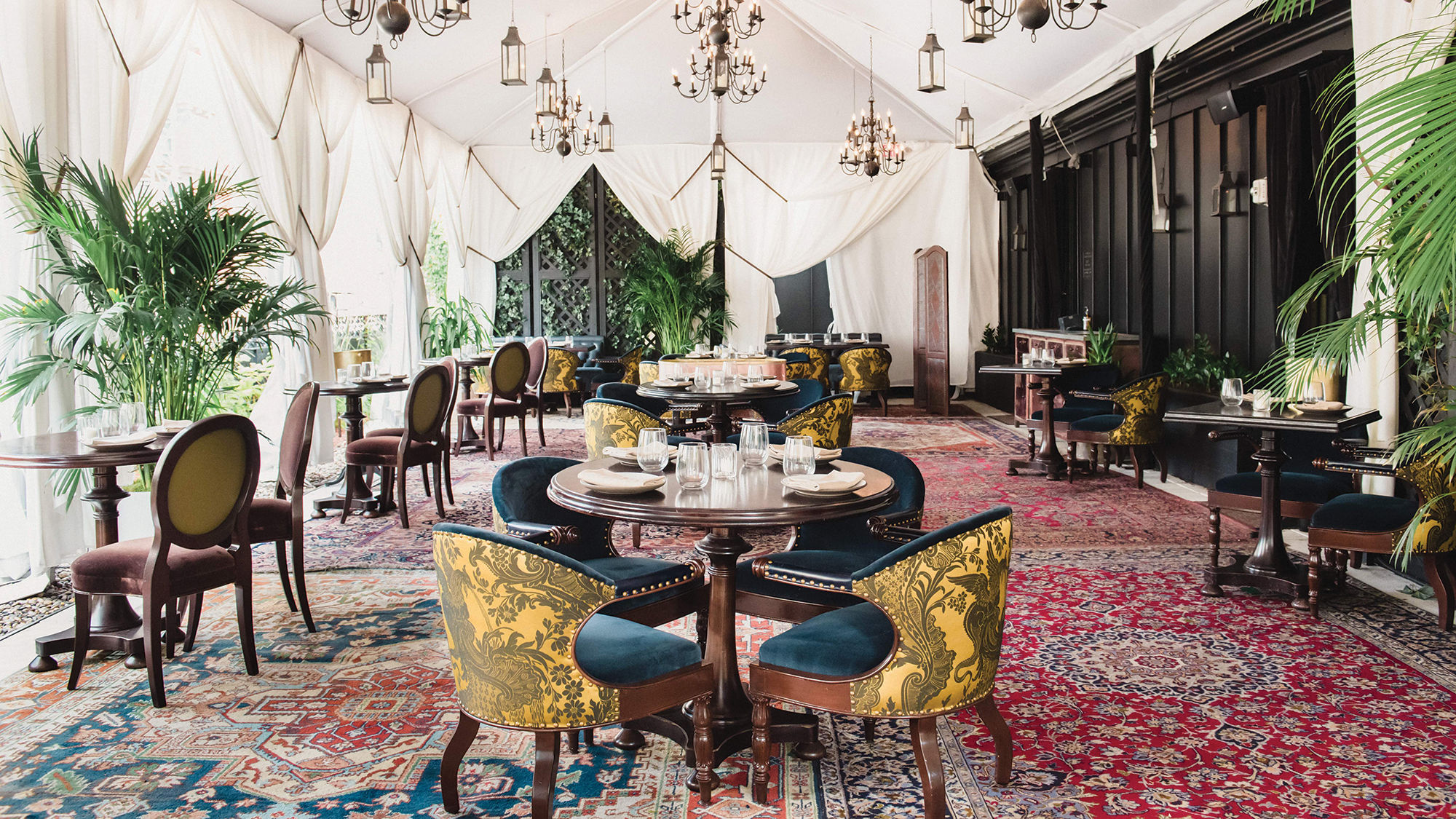 A tent and heaters keep diners warm and dry in the open-air rooftop dining venue at the NoMad New York.