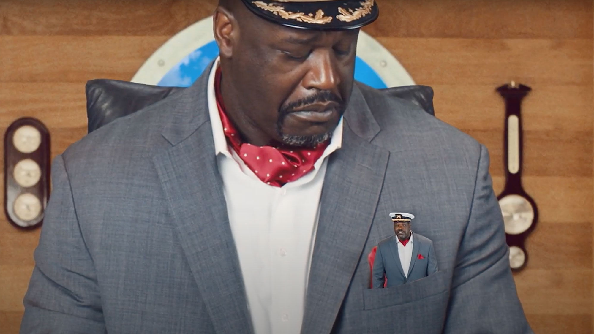 A still from an online marketing campaign by Carnival Cruise Line featuring Shaq and his pocket-sized "Mini CFO."