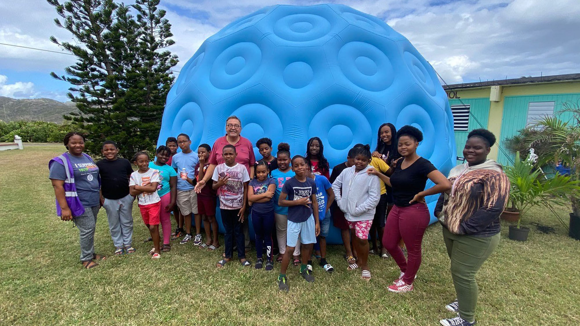 Schoolchildren outside of the new planetarium on the island of St. Eustatius.