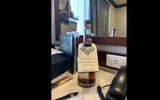 Guests for the christening cruise were presented with bottles of craft bourbon etched with the original launch date of April 4, 2020. A paper sleeve was added with the amended date of March 21, 2021.