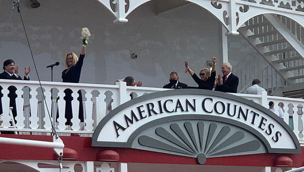 Angie Hack prepares to christen the American Countess with a bottle of Maker’s Mark in New Orleans on Sunday. To the right is CEO John Waggoner and his wife, Claudette; they are Hack Angie Hack prepares to christen the American Countess with a bottle of Maker’s Mark in New Orleans on Sunday. To the right is CEO John Waggoner and his wife, Claudette; they are Hack's parents.
