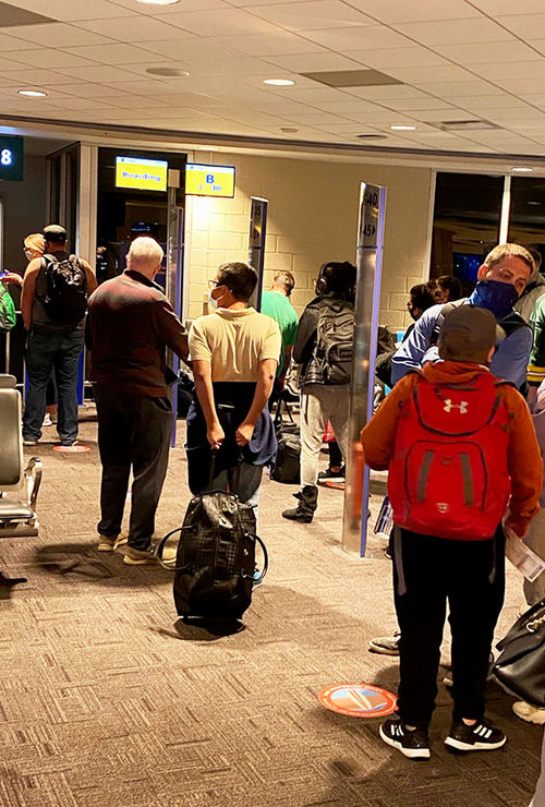 Passengers line up to board a Southwest flight. Passengers line up to board a Southwest flight.