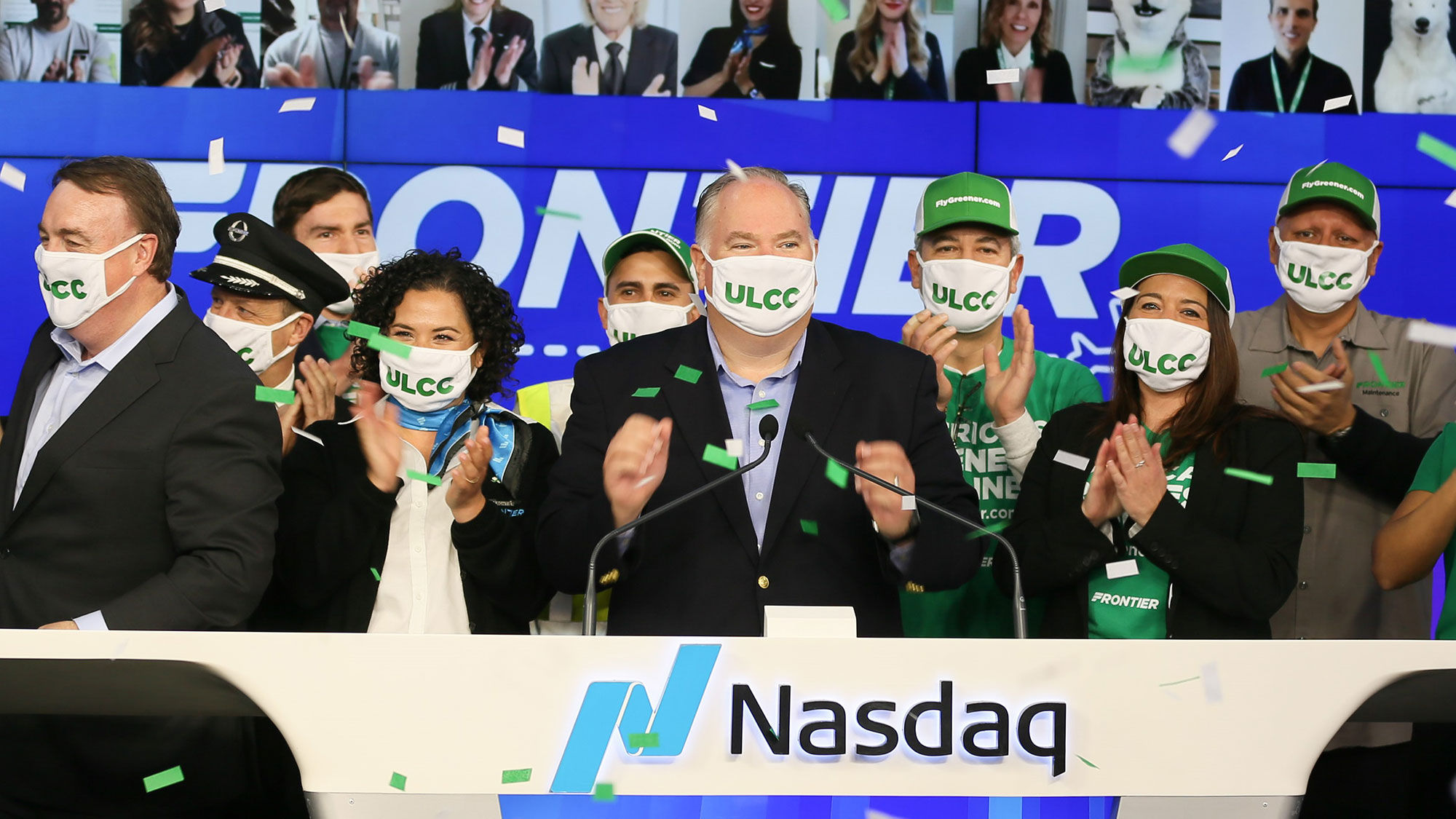 Frontier Airlines CEO Barry Biffle applauds alongside Frontier employees after ringing the opening bell at the Nasdaq Thursday morning.