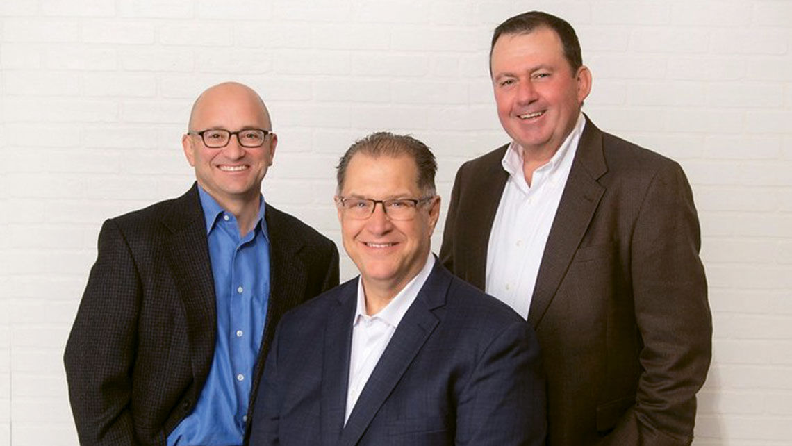 Mike Going, center, founded MPG Travel Solutions with Ken Pomerantz, left, and Terry Morrison. Going died Tuesday at age 63.