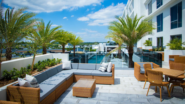 A terrace overlooking the pool deck at the new Hilton Aventura Miami.