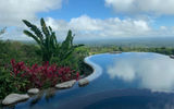 Origins Luxury Lodge Costa Rica features and infinity pool with sweeping views of the valley and, on a clear day, Lake Nicaragua.