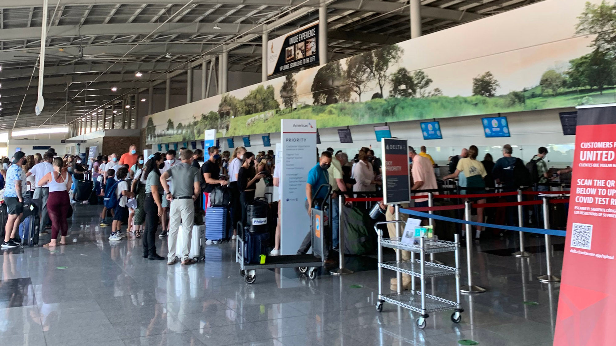 The requirement to provide proof of a negative  Covid-19 test to enter the U.S. means long check-in times on American Airlines, even when traveling with only carry-ons.