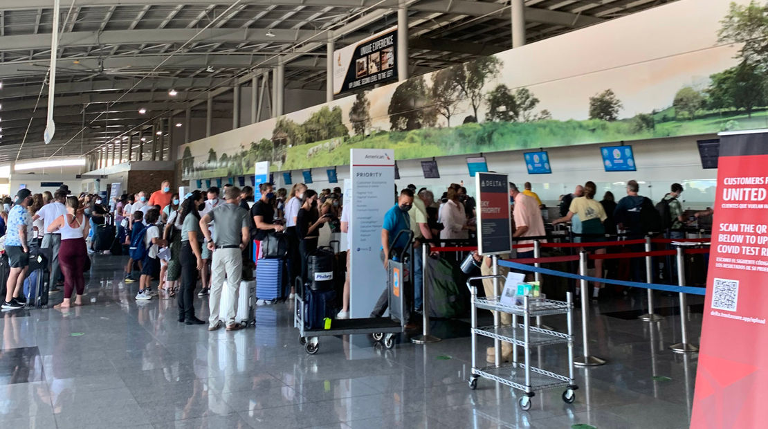 International travel's current hurdles: Travelers waiting to produce proof of a negative Covid-19 test in Costa Rica.