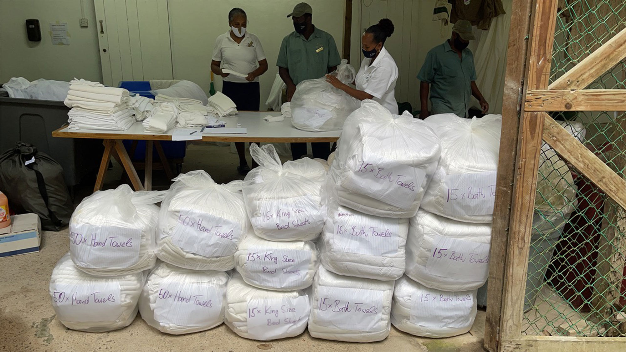 Staff at Jade Mountain resort on St. Lucia pack up supplies to send to evacuees living in shelters in St. Vincent.