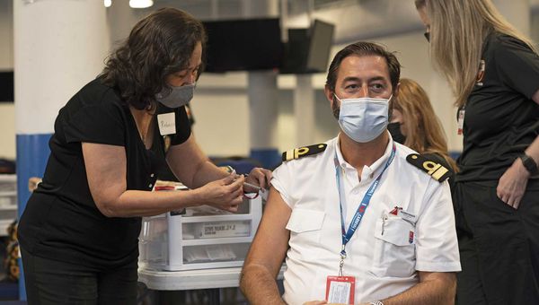 Carnival Cruise Line staff captain Riccardo Galazzo is vaccinated during a rally in Galveston, Texas, to suport the return of cruising. More than 300 Carnival crew were vaccinated at the event.