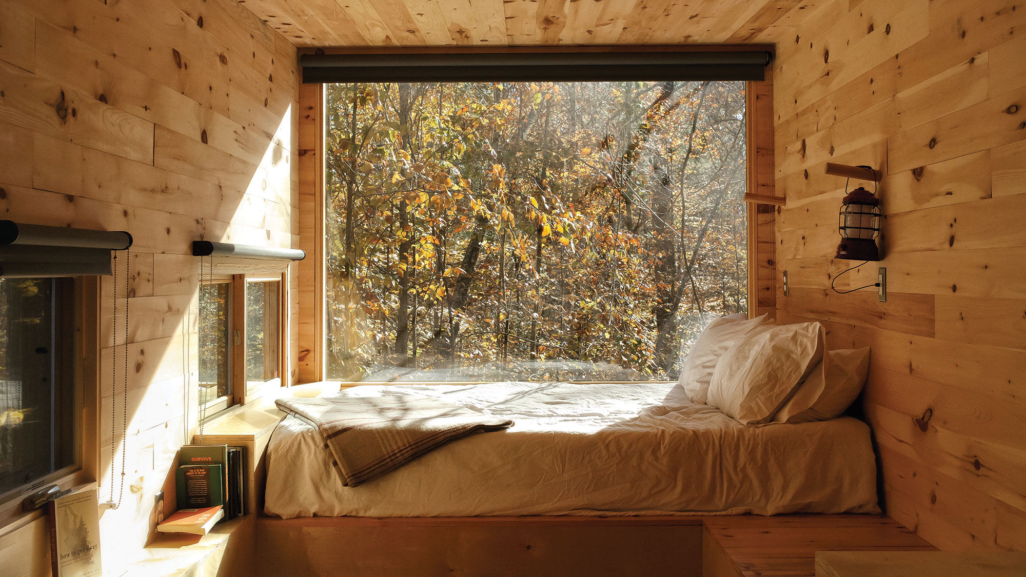 Each Getaway cabin features a queen bed and large windows.