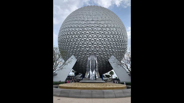 Epcot is in the middle of a transformation that is ongoing despite the pandemic. Here, a new fountain and pylons greet guests in front of the park's icon, Spaceship Earth.