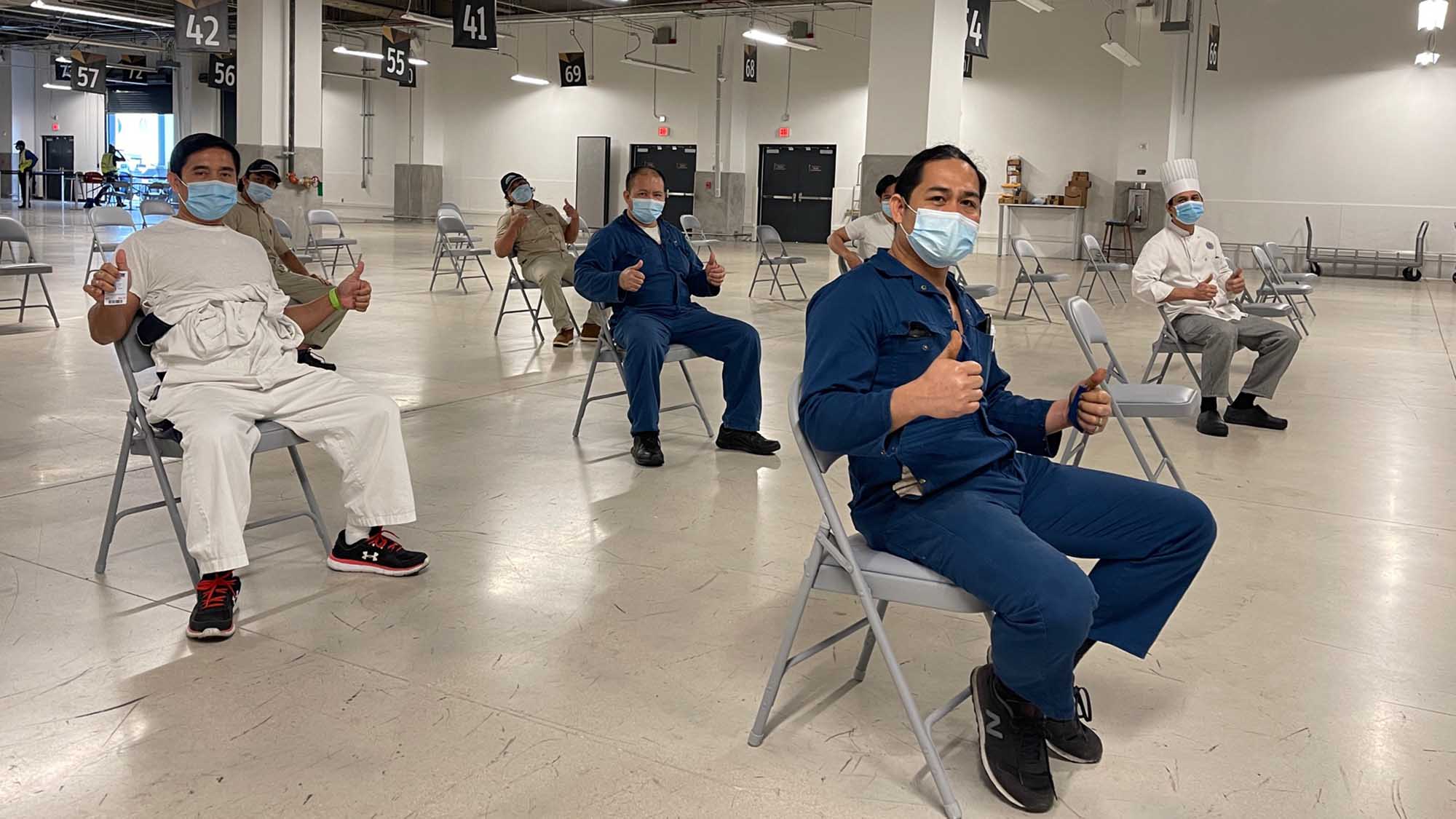 Royal Caribbean International crew waiting to be vaccinated at PortMiami earlier this month, part of a partnership between the port and the line to vaccinate crew ahead of major ship relaunches.
