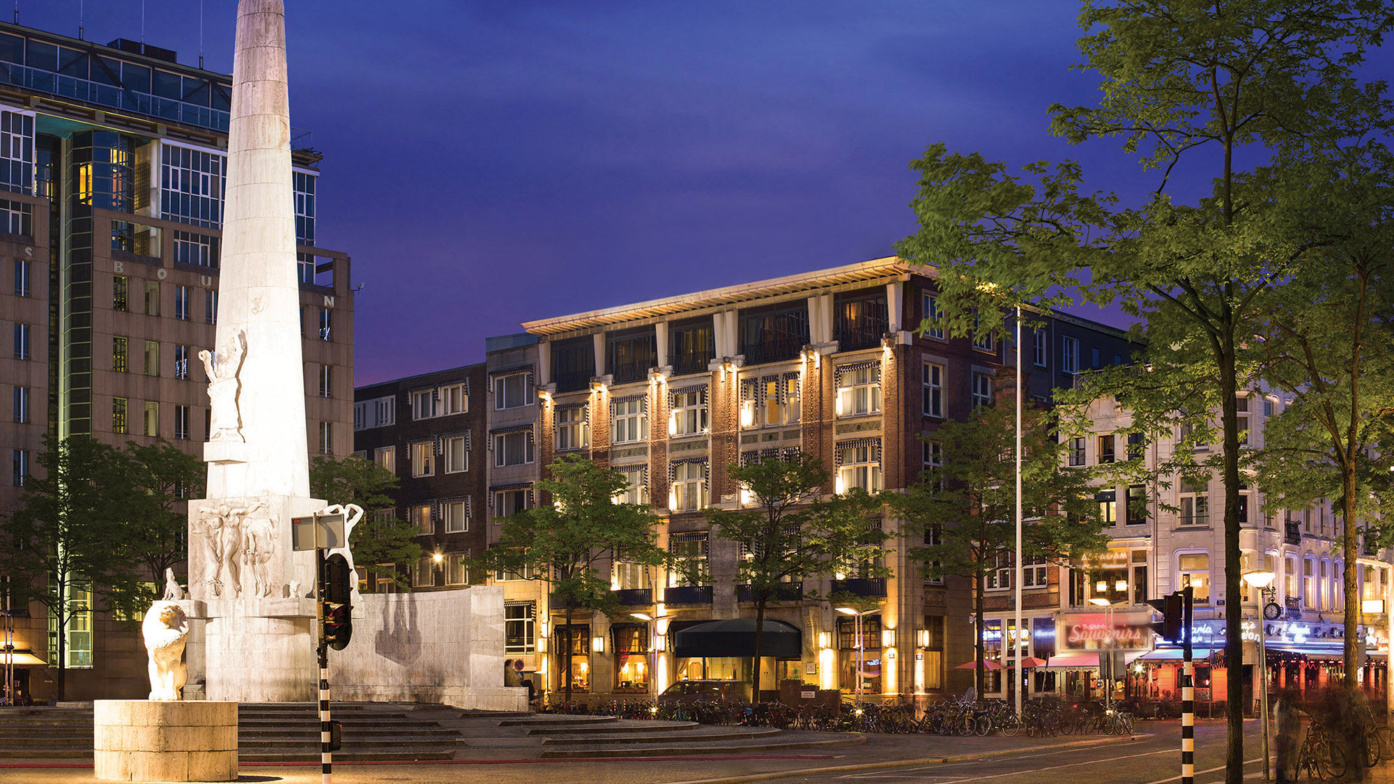 The Anantara Grand Hotel Krasnapolsky Amsterdam at dusk.