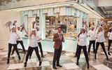 Dancers dressed in chef coats surround Sean McBurney, regional president of Caesars Entertainment, at the reopening of the Bacchanal Buffet.